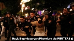 ARMENIA - Law enforcement officers detain a protester near the government building during a rally to demand the resignation of Armenian Prime Minister Nikol Pashinian, September 21, 2023.