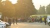 Residents gather next to buses in central Stepanakert before leaving Nagorno-Karabakh, September 25, 2023.
