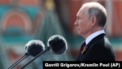 Владимир Путин выступает с речью на Красной площади в Москве. 9 мая 2022 года.