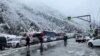 RUSSIA - Cars and heavy trucks are lined up near the Upper Lars border crossing with Georgia, November 21, 2023.