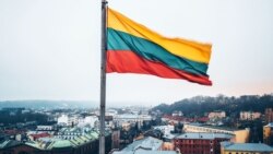 LITHUANIA – Lithuanian flag over the city of Kaunas, which is located 104 kilometers from the capital of Lithuania