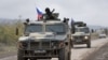 Nagorno-Karabakh - Armored vehicles of Russian peacekeepers move along the road towards Agdam from their checkpoint outside Askeran (file photo). 