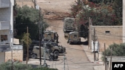 Trupe și vehicule israeliene în centrul orașului Jenin, în timpul unui raid militar în Cisiordania. 5 septembrie 2024.