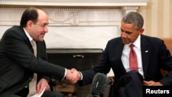 ABŞ-nyň prezidenti B.Obama (s) we Yragyň premýer-ministri N.al-Maliki (ç) Waşington, 2013. 