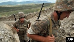 Nagorno-Karabakh -- Armenian soldiers of the self-proclaimed republic of Nagorno-Karabagh walk in a trench at the frontline on the border with Azerbaijan near the northeastern town of Martakert, 06Jul2012