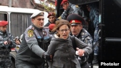 Armenia - Riot police detain a protester in Yerevan, 2Dec2013.