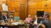 Prime minister Ludovic Orban smoking in the government office