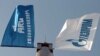 Armenia -- The flags of the ARG national gas operator and its dominant Russian shareholder, Gazprom.