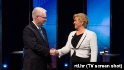 Кандидати на посаду президента Хорватії Іво Йосипович (л) і Колинда Ґрабар-Китарович (п), Загреб, 4 січня 2015 року