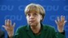 Poraz Merkel na pokrajinskim izborima, jačaju kritike iz Pariza
