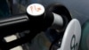 FILE PHOTO: A GM Hydrogen Fuel Cell vehicle is seen being fueled at the Shell Hydrogen fueling station during its opening at JFK Airport in New York July 14, 2009.