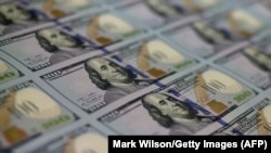 U.S. - Newly redesigned $100 notes lay in stacks at the Bureau of Engraving and Printing in Washington, DC, May 20, 2013.