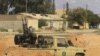 Liwiýanyň hökümet harbylarynyň maşyny Tripoli bilen Bani Walidiň aralygynda, 23-nji mart 2011-nji ýyl