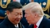 Президент США Дональд Трамп (п) може бути не готовим зруйнувати торгівлю із Китаєм заради тиску на Росію