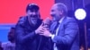 Armenia - Armenian-American rock musician Serj Tankian (L) and opposition leader Nikol Pashinian appear before thousands of people rallying in Republic Square in Yerevan, 7 May 2018.