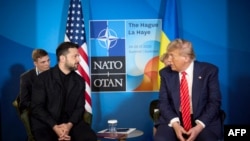 In this handout photograph taken and released by the Ukrainian Presidential Press Service on June 25, 2025, Ukraine's President Volodymyr Zelensky (L) meets with US President Donald Trump on the sideline of the North Atlantic Treaty Organization (NATO) summit in The Hague. 